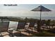 Inviting pool area with lounge chairs, umbrellas, and ocean views, perfect for relaxation at The Sandcastle at 3560 Shipwatch Rd, Kiawah Island, SC 29455