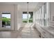 Bright sunroom features lots of natural light and beautiful views of the outdoor greenery at 3560 Shipwatch Rd, Kiawah Island, SC 29455