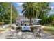 Spacious backyard patio with ample seating, overlooking manicured lawn and luxury pool at 3685 Colonel Vanderhorst Cir, Mount Pleasant, SC 29466