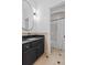 Charming bathroom with a black vanity and tile flooring at 3685 Colonel Vanderhorst Cir, Mount Pleasant, SC 29466