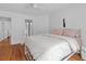 Bright bedroom with hardwood floors, a large window and minimalist decor provides a calming atmosphere at 3685 Colonel Vanderhorst Cir, Mount Pleasant, SC 29466