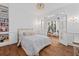 Inviting bedroom with a comfortable bed and views into a workout room with a spiral staircase at 3685 Colonel Vanderhorst Cir, Mount Pleasant, SC 29466