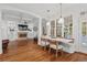 Bright dining area with large windows, hardwood floors, and view of the living room at 3685 Colonel Vanderhorst Cir, Mount Pleasant, SC 29466
