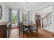 Elegant dining room with hardwood floors, chandelier, and natural light at 3685 Colonel Vanderhorst Cir, Mount Pleasant, SC 29466