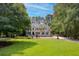 Beautiful brick home with a manicured lawn and mature trees providing privacy and curb appeal at 3685 Colonel Vanderhorst Cir, Mount Pleasant, SC 29466