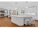 This kitchen features a large center island with seating and lots of natural light at 3685 Colonel Vanderhorst Cir, Mount Pleasant, SC 29466