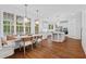 Eat-in kitchen features white cabinetry, stainless steel appliances, and a large dining area at 3685 Colonel Vanderhorst Cir, Mount Pleasant, SC 29466