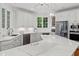 Spacious kitchen features an island with cooktop, stainless steel appliances, and lots of cabinetry at 3685 Colonel Vanderhorst Cir, Mount Pleasant, SC 29466