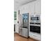 Modern kitchen features stainless steel refrigerator, microwave, and oven at 3685 Colonel Vanderhorst Cir, Mount Pleasant, SC 29466