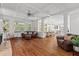 Spacious living room with a fireplace, hardwood floors, and large windows for natural light at 3685 Colonel Vanderhorst Cir, Mount Pleasant, SC 29466