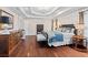 Spacious main bedroom featuring hardwood floors, tray ceiling and ample natural light at 3685 Colonel Vanderhorst Cir, Mount Pleasant, SC 29466