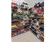 This walk-in closet features extensive shoe shelves for organization at 3685 Colonel Vanderhorst Cir, Mount Pleasant, SC 29466