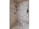 Shower with neutral-colored tile, a built-in seat, and a rainfall showerhead at 3685 Colonel Vanderhorst Cir, Mount Pleasant, SC 29466
