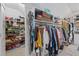 Bright walk-in closet with custom shelving provides ample storage for clothes, shoes, and accessories at 3685 Colonel Vanderhorst Cir, Mount Pleasant, SC 29466