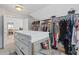 Walk-in closet with built-in shelves, drawers and a dressing area at 3685 Colonel Vanderhorst Cir, Mount Pleasant, SC 29466