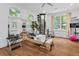 Well-lit workout room with a reformer machine and spiral staircase at 3685 Colonel Vanderhorst Cir, Mount Pleasant, SC 29466
