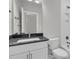 Well-lit bathroom with modern fixtures, white cabinets, and shower-tub combination at 395 Wappoo Trace Ln, Summerville, SC 29486