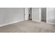 Clean bedroom with neutral carpeting, white trim, and closet space at 395 Wappoo Trace Ln, Summerville, SC 29486