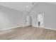 Spacious bedroom with high ceilings, light-colored hardwood floors, and ensuite bathroom at 395 Wappoo Trace Ln, Summerville, SC 29486