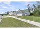Charming home featuring well-maintained landscaping, a two-car garage, and inviting curb appeal at 395 Wappoo Trace Ln, Summerville, SC 29486