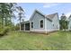 Light blue house with an open screened-in porch and nice green lawn at 395 Wappoo Trace Ln, Summerville, SC 29486