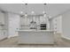 Modern kitchen with white cabinets, stainless steel appliances, and center island at 395 Wappoo Trace Ln, Summerville, SC 29486