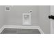 Clean laundry room showing hookups, grey tile floor and white trim at 395 Wappoo Trace Ln, Summerville, SC 29486