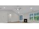 Open concept living room with backyard access and fireplace at 395 Wappoo Trace Ln, Summerville, SC 29486