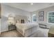 Bedroom with a large bed, gray walls, a window, and a gray nightstand with a lamp at 432 Caledon Ct, Johns Island, SC 29455