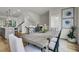 This dining room includes seating for six and an adjacent staircase at 432 Caledon Ct, Johns Island, SC 29455