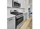 Close-up of a kitchen featuring stainless steel gas range, microwave, subway tile backsplash, and quartz countertops at 432 Caledon Ct, Johns Island, SC 29455