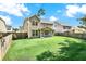 Large, well-maintained backyard with a screened-in porch and wooden fence at 466 Gianna Ln, Goose Creek, SC 29445