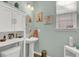 Light and bright powder room with modern fixtures and wall art at 466 Gianna Ln, Goose Creek, SC 29445