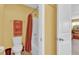 Bright bathroom featuring a tub and shower, decorative towels, and a white toilet at 466 Gianna Ln, Goose Creek, SC 29445