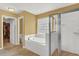 Bathroom with glass shower, garden tub, tile floor and spacious walk-in closet at 466 Gianna Ln, Goose Creek, SC 29445