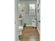 Cozy powder room featuring wood-look flooring and refreshing blue-green walls at 466 Gianna Ln, Goose Creek, SC 29445