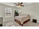 Well-lit bedroom featuring ceiling fan, window, and neutral decor at 466 Gianna Ln, Goose Creek, SC 29445