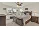 Bedroom with a large window, ceiling fan and a decorative dark-wood framed bed at 466 Gianna Ln, Goose Creek, SC 29445