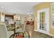 Open concept dining area with view to kitchen and living spaces at 466 Gianna Ln, Goose Creek, SC 29445