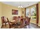 Formal dining room showcasing a decorative chandelier, natural light, and hardwood floors at 466 Gianna Ln, Goose Creek, SC 29445
