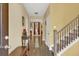Inviting entryway with wood floors and staircase, creating a warm and welcoming atmosphere at 466 Gianna Ln, Goose Creek, SC 29445