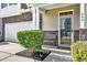 Entrance with stone accents, featuring a decorative front door and an adjacent bench at 466 Gianna Ln, Goose Creek, SC 29445