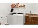Laundry room with washer, dryer, utility sink, cabinets and shelving for storage at 466 Gianna Ln, Goose Creek, SC 29445