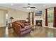 Comfortable living room with hardwood floors, a fireplace, and bright natural light at 466 Gianna Ln, Goose Creek, SC 29445