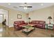 Spacious living room with hardwood floors and contemporary furnishings under a ceiling fan at 466 Gianna Ln, Goose Creek, SC 29445