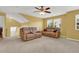 Bright and airy living room with high ceilings and comfortable leather couches at 466 Gianna Ln, Goose Creek, SC 29445