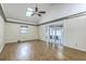Expansive bonus room features hardwood floors, a ceiling fan, a skylight and a walkout to the porch at 4729 Lang Ridge Dr, North Charleston, SC 29405