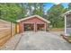 Detached garage with brick exterior, two bays, and a long driveway at 4729 Lang Ridge Dr, North Charleston, SC 29405