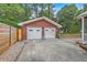 Two car detached brick garage with a concrete driveway and well maintained landscaping at 4729 Lang Ridge Dr, North Charleston, SC 29405