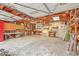 Spacious garage interior with ample workbench space, storage shelves, and an open ceiling at 4729 Lang Ridge Dr, North Charleston, SC 29405